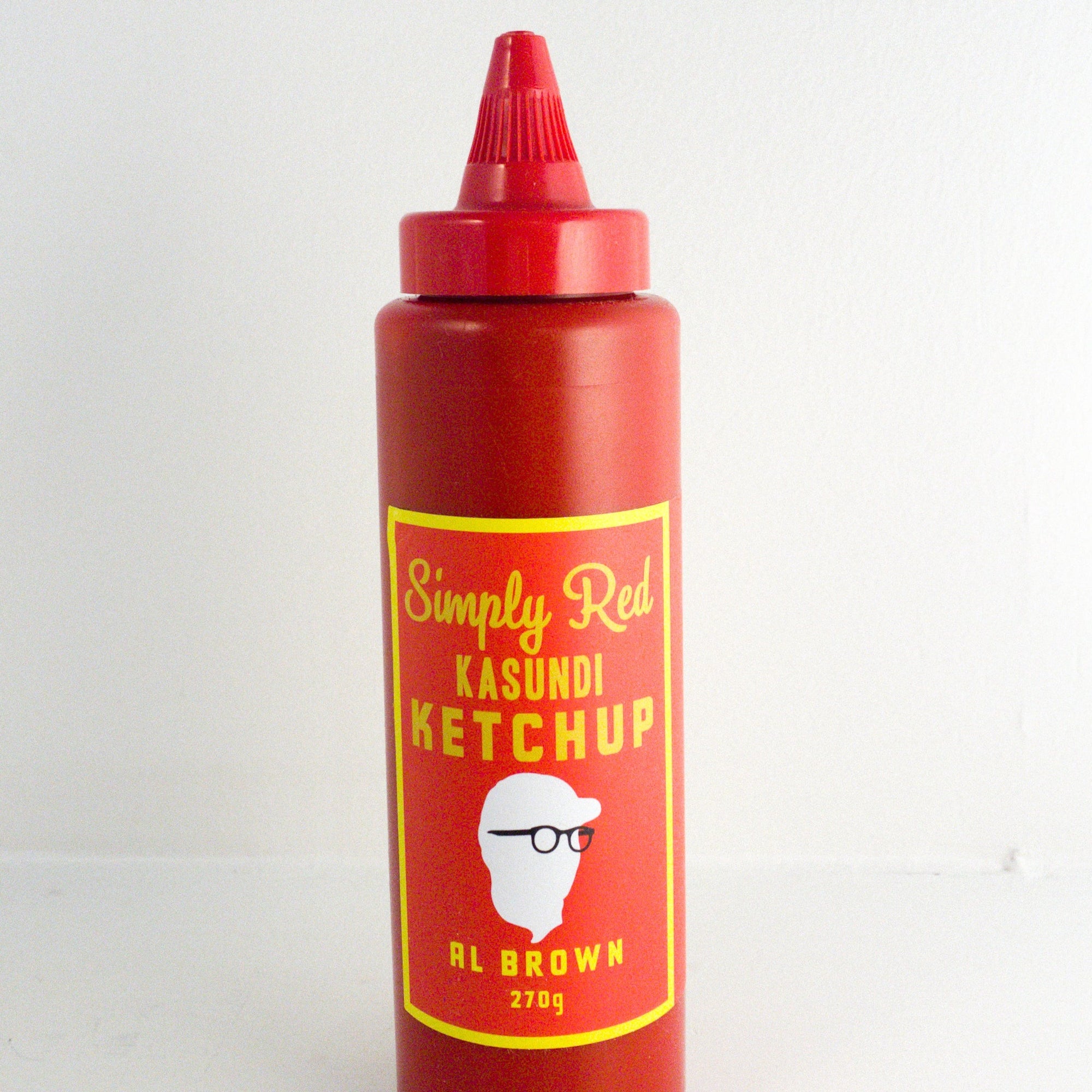 image of a red bottle of tomato ketchup with yellow text 