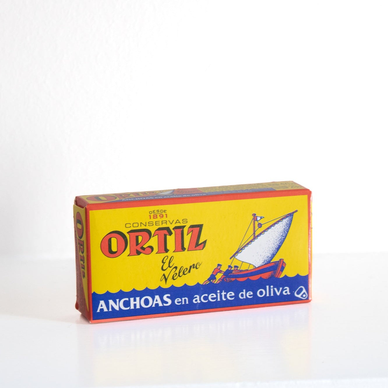 image of a box of anchovies, a yellow and blue box with red and white text 