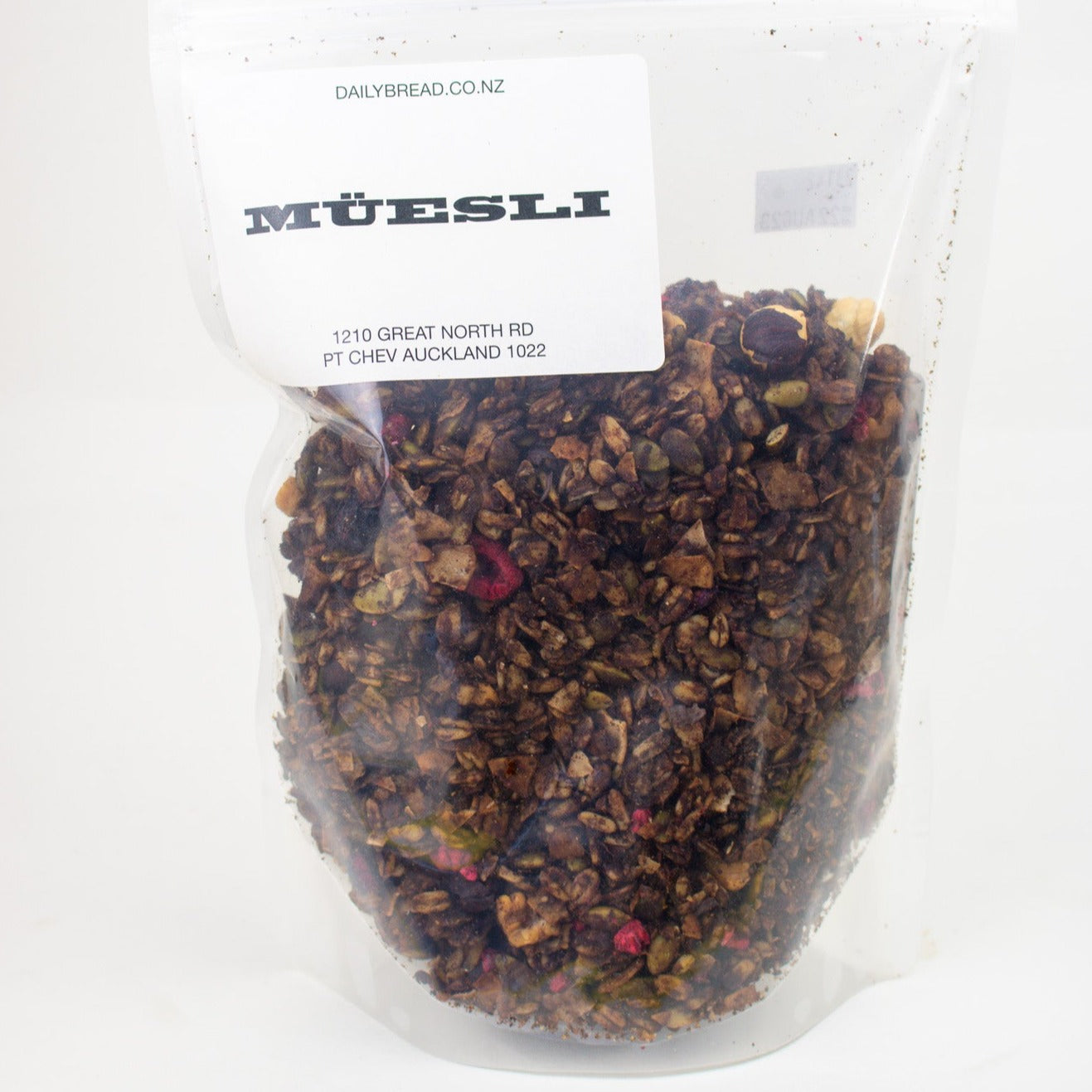 image of a bag filled with muesli and a white label