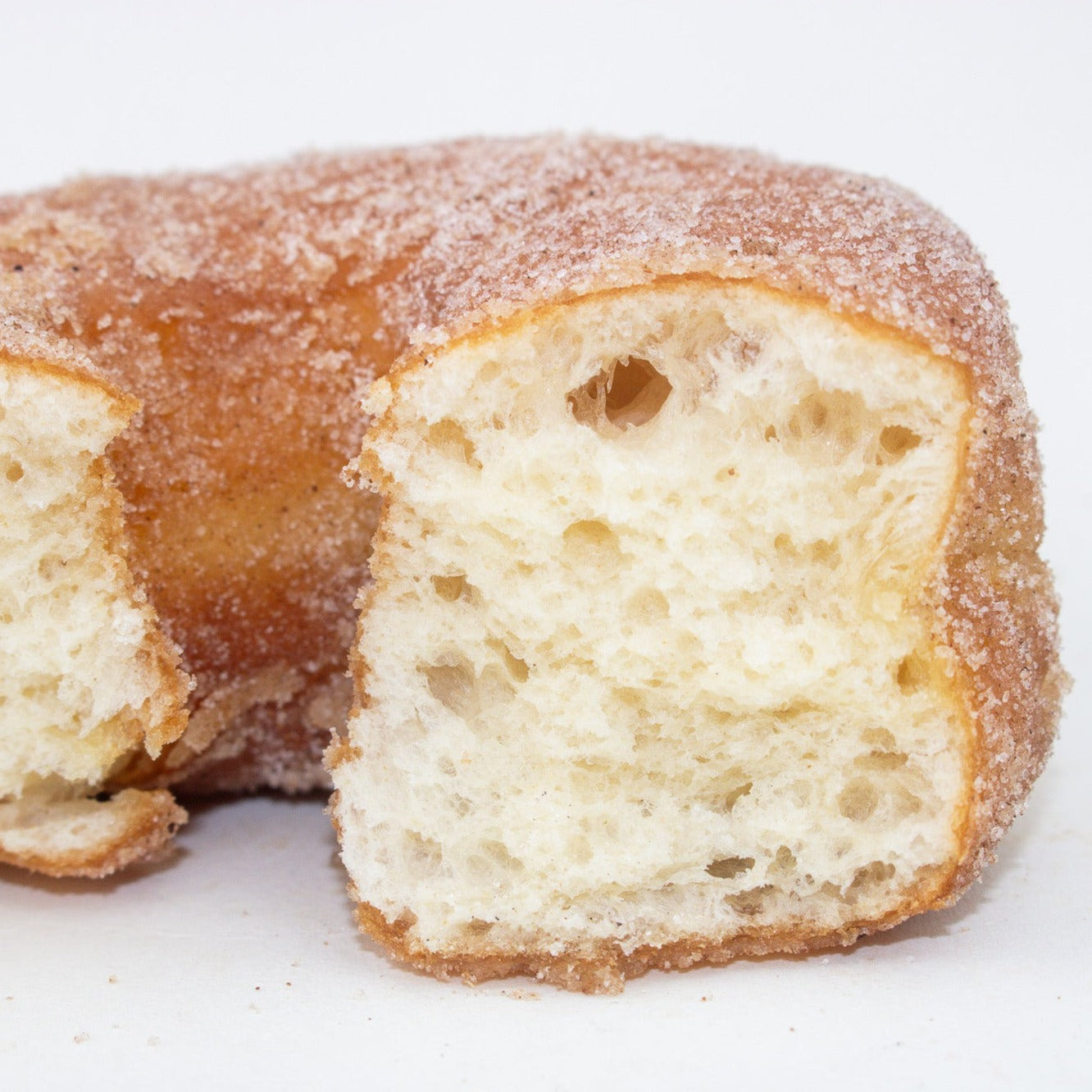 image of the inside of the doughnut that has been torn in half 