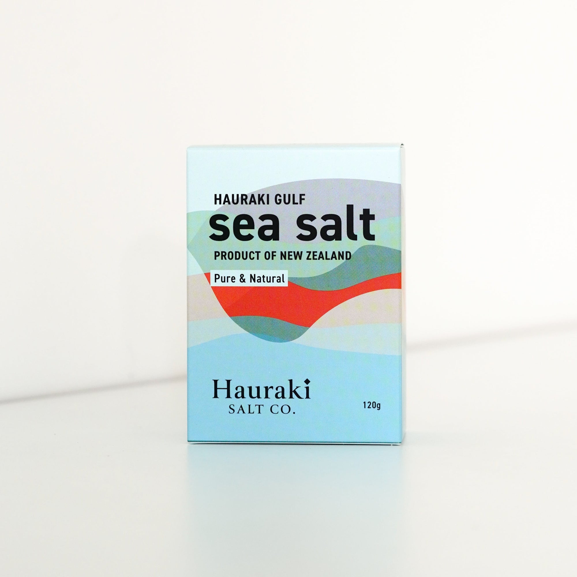 image of a rectangular blue and red box with black text. the text says 'Hauraki Gulf sea salt' and is 120grams