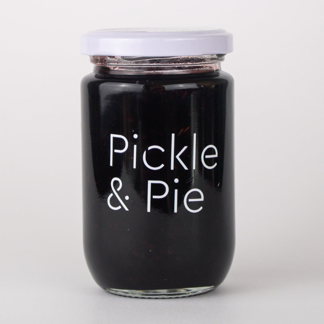 image of a jar of jam. the jam is a dark purple and the lid and text is white 