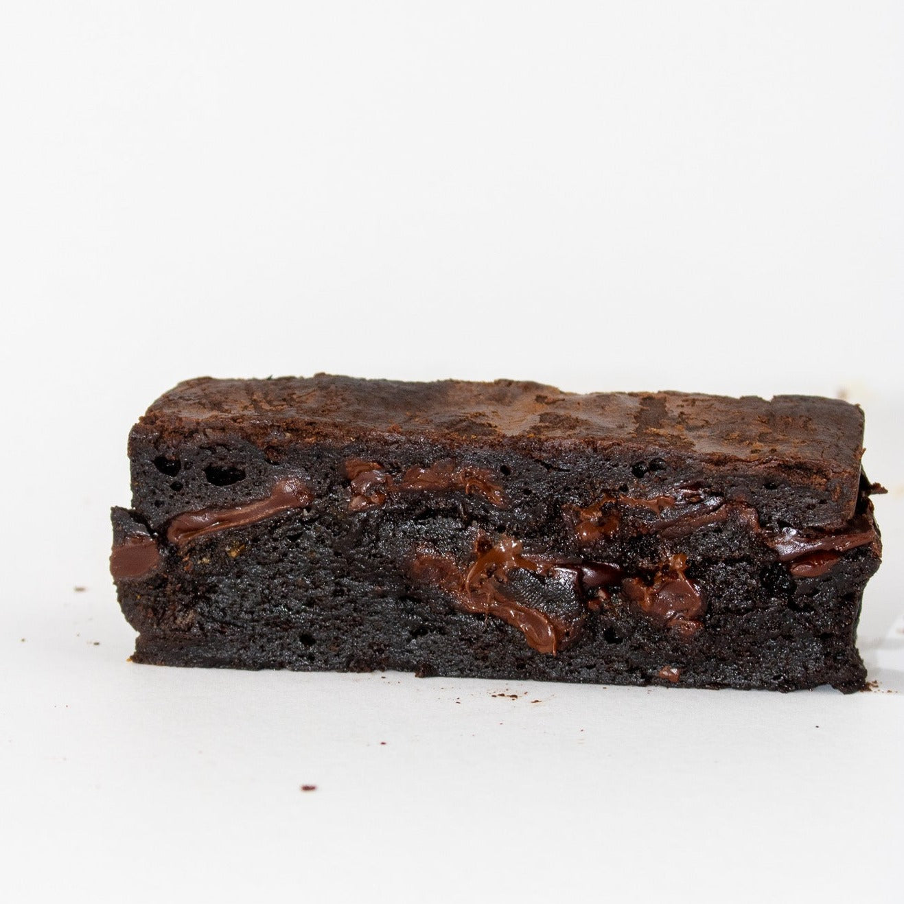 image of dark and milk chocolate brownie slice. slightly melted 